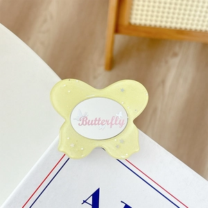Glittery yellow butterfly phone grip with stars and Butterfly text in a cute resin style