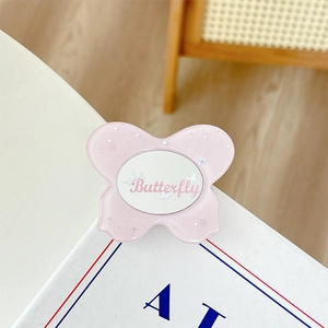 Pink butterfly phone grip featuring silver glitter, sequins and a small built-in mirror
