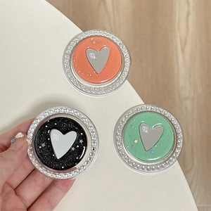 Sparkling rhinestone heart phone socket grip in orange, black and mint green with glitter