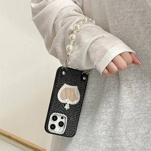 Luxury iPhone case with black croc leather texture, crystal spade and white pearl strap