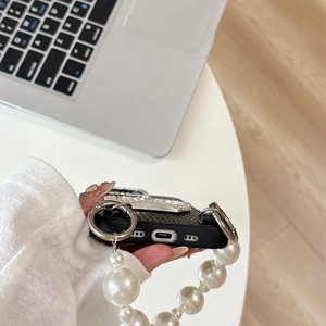 Black lizard texture phone case with pearl crown and large beaded hand strap for iPhone
