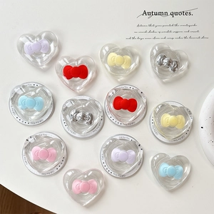 Magnetic MagSafe heart phone socket with colorful bows on polished acrylic surface