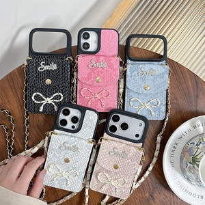 Crossbody iPhone case with snakeskin texture, card holder, bow, and long chain strap