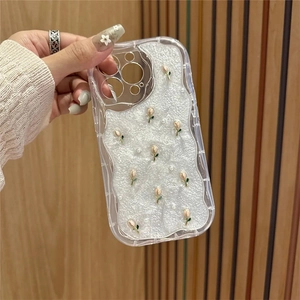 Detail of clear wave edge phone case with 3D tulip and pearl embellishments