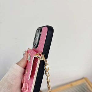 Pink bow phone case with card holder and metal chain strap in litchi leather detail