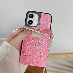 Detailed view of pink snakeskin pattern phone case with crystal cardslot and bow tie