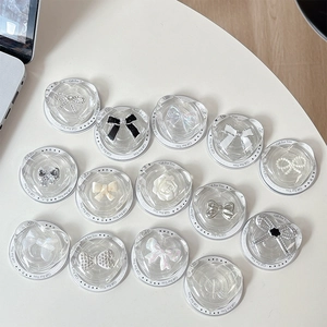 Transparent heart-shaped MagSafe phone grips with diverse bow and floral decorations