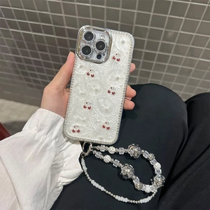 White cherry and pearl relief iPhone case with a matching silver beaded phone charm