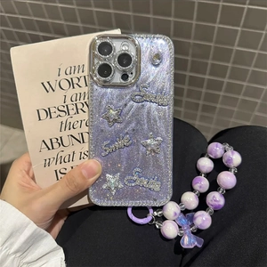 Purple glitter iPhone case with star patterns, Smile lettering, and beaded lanyard