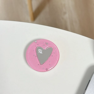 Macro di supporto per telefono rosa glitter con specchio a cuore e scritta mi ne.