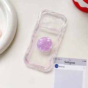 Transparent purple glitter phone case with a matching shell texture expanding grip stand