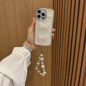 Coque iPhone de luxe à paillettes avec nœuds 3D, strass et dragonne en perles chic