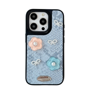 Blue snake skin texture iPhone case with 3D floral decorations and pearl bow accents