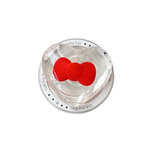 Magnetic MagSafe phone grip featuring a transparent heart shape and red bow tie design