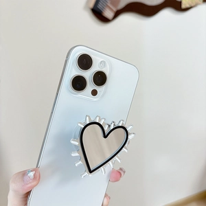 Silver heart mirror phone grip with reflective finish and clear acrylic frame on phone