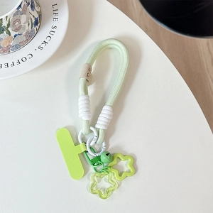Macro detail of braided green phone lanyard with star charms and metal clasp clip
