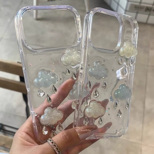 Transparent iPhone case with 3D glitter clouds and star sequins in a handheld display