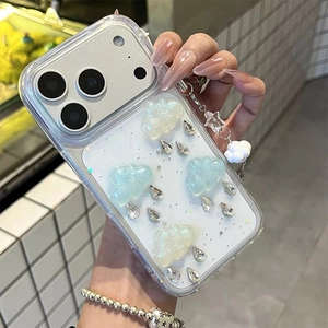 Close-up of 3D glitter cloud iPhone case with water drops and star charms
