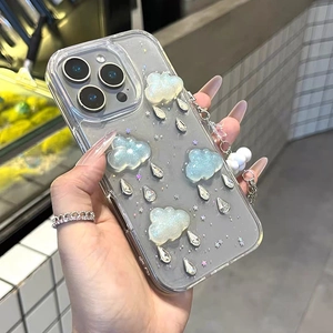 Detailed shot of transparent iPhone case with 3D cloud, waterdrop rhinestones and glitters