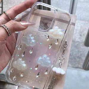 Detail of 3D cloud and droplet crystal design on a clear phone case with a star chain