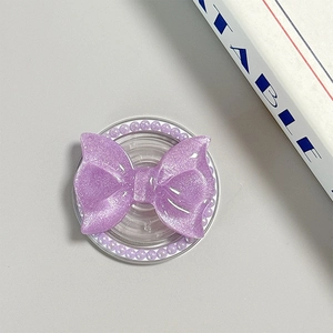 Detail of purple glitter bow phone grip with pearl trim and transparent base