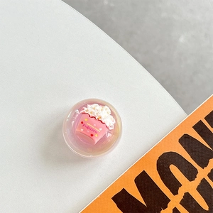 Close-up of pink popcorn bucket cell phone pop grip holder with clear bubble dome top