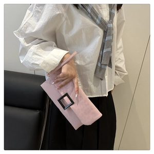 Detail of pink leopard print clutch bag with matte texture and decorative black square buckle