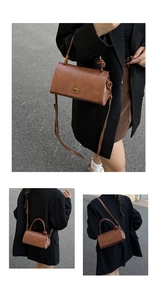 Detail view of brown retro small square bag with golden lock and knot handle design