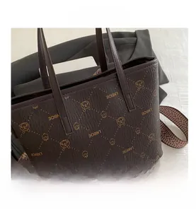 Detail of the LNBOE tote bag with bunny print and patterned woven shoulder strap