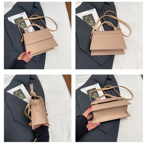 Detail view of apricot trapezoid shoulder bag with knotted handle and sleek faux leather