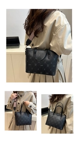 Detail of black printed tote bag featuring bear patterns and a wide woven shoulder strap