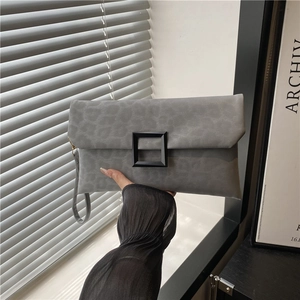Chic grey envelope clutch bag with leopard embossing and bold black square buckle design