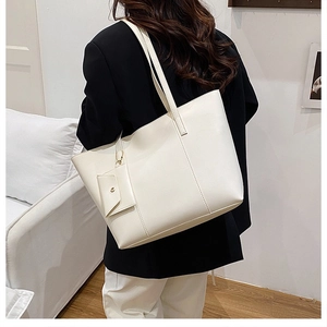 Detailed back view of off-white tote bag with small pouch for commuter fashion