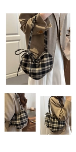 Detail of heart-shaped plaid crossbody bag with a bow-knot tie strap in wool fabric