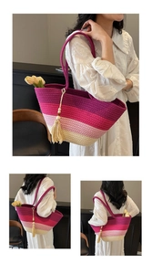 Detail of woven straw tote bag featuring gradient purple stripes and beige fringe tassel