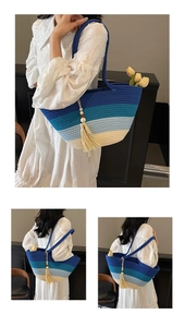Detail of woven straw tote bag with blue gradient stripes and decorative wood bead tassels