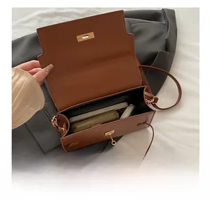 Interior view of the vintage brown crossbody bag showing spacious main compartment