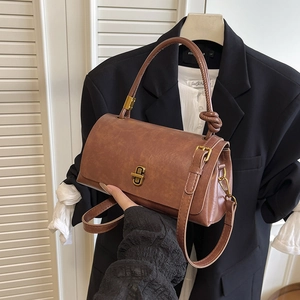 Vintage brown leather-texture small square handbag with golden twist lock and top handle