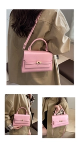 Detail showing pink flap crossbody bag with golden twist lock and adjustable strap