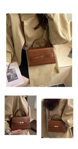 Detail of a brown leather handbag with a vintage metal twist lock and a top handle