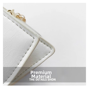 Close-up of the pleated texture fabric and fine stitching on white crossbody bag
