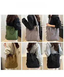 Multiple views of large canvas tote bags with front zipper pockets in various colors
