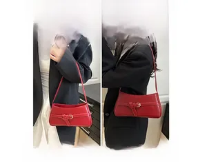 Detail view of red leather shoulder bag showing handbag and crossbody wearing styles