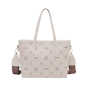Minimalist cream white bucket bag with cartoon rabbit print and ethnic woven strap