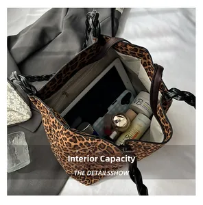 Detail view of large leopard print tote bag interior capacity with tablet and pockets