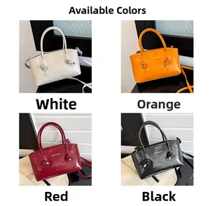 Detail view of the four color options for the glossy leather handbag with knotted handles