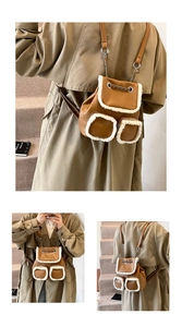 Detail of a brown faux leather mini backpack with plush trim and chain straps