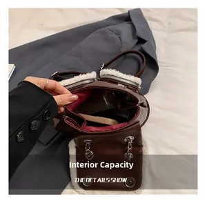 Detailed view of the large capacity tote bag with brown leather and white fuzzy trim
