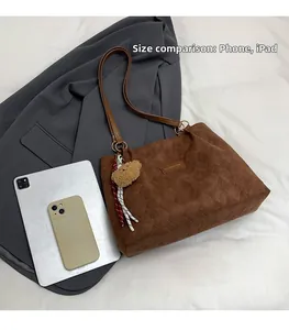 Brown corduroy tote bag detail with Creative Cat tag and size comparison with iPad