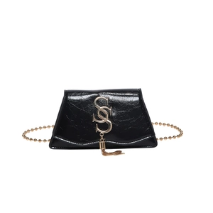 Retro black glossy leather crossbody bag with gold chain and metal tassel logo